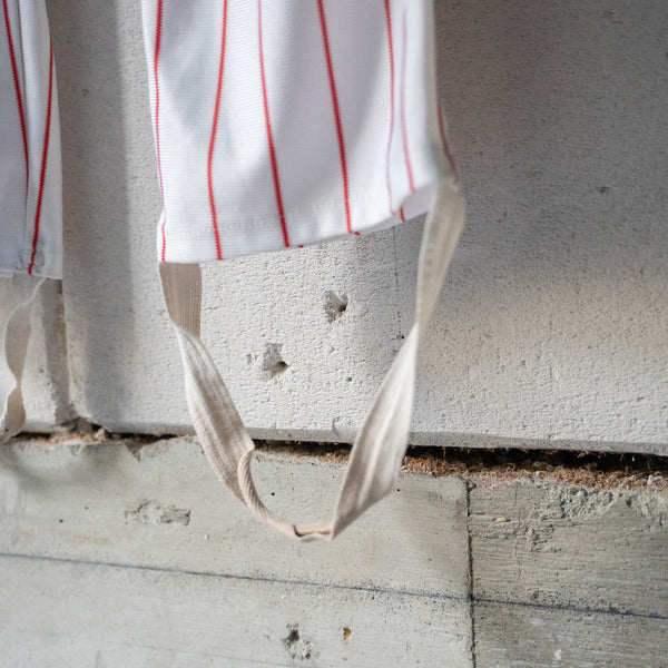 around 1980s white × red stripe baseball uniform pants