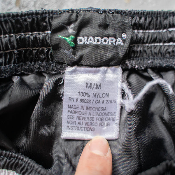 2000s 'DIADORA' black nylon track short pants